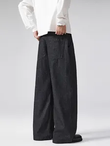 Men's old money style black wide leg trousers with subtle vertical stripes and loose fit