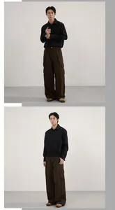 Detail of dark brown wide-leg cargo pants with large side utility pockets and pleated design