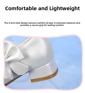 Close-up of white girls' formal shoes featuring a 2.5cm heel and pearl texture finish
