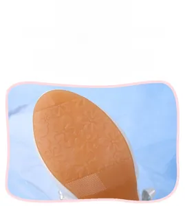 Macro view of non-slip amber rubber sole with flower patterns for girls' shoes