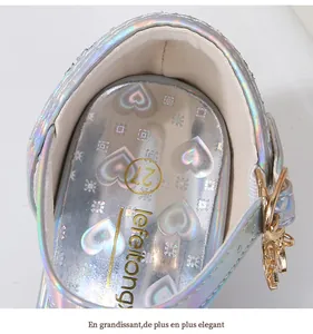 Detailed macro view of iridescent girls sandals with gold heart charm and size 27 insole