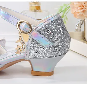 Detail of glitter girls princess shoes featuring rhinestone moon and star charms