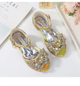 Detailed top view of girl sparkly sequin sandals with rhinestone bow and ankle buckle