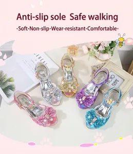 Close-up of glitter girls' princess shoes with large bows and pearl heart details