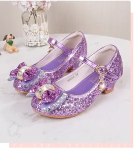 Detail of purple sequin Mary Jane shoes with rhinestone bow and sparkly finish
