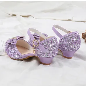 Detail of girls purple sequin heels with pearl bow and star pendant side view