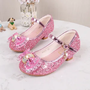 Sparkly pink sequin Mary Jane shoes for girls featuring a rhinestone bow and moon charm