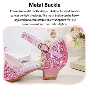 Detail of pink sequin girl's princess sandals featuring a metal buckle and star moon charm