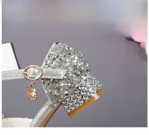 Detail view of 2.5cm low block heel with silver glitter and celestial star moon charms