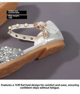 Detail of silver sequin girl's shoe with pearl strap, star charm and 1cm anti-slip sole