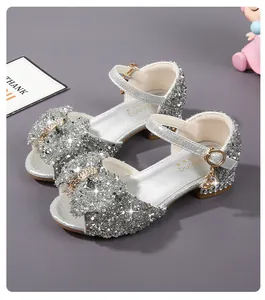 Detailed top view of silver glitter girls sandals with a bow and sparkling sequins