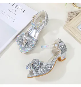 Detailed view of silver glitter girls' princess shoes with sequin bow and pearl detail