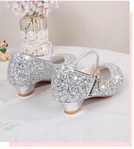 Detail of silver sequin Mary Jane shoes for girls featuring a sparkly diamond pendant