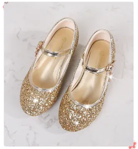Detailed top view of gold sequin Mary Jane shoes with adjustable buckle for girls