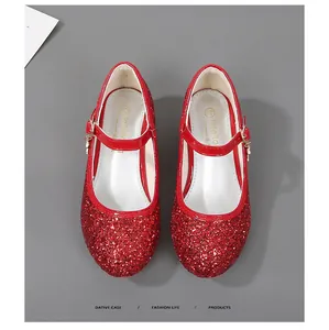 Detailed top view of red sequin Mary Jane shoes with buckle and gold charm for girls