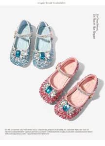 Detailed view of sparkly sequined princess shoes with large crystals in blue and pink