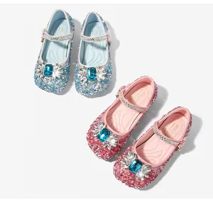 Close-up of glittery Mary Jane princess shoes with blue gemstone and sequin details