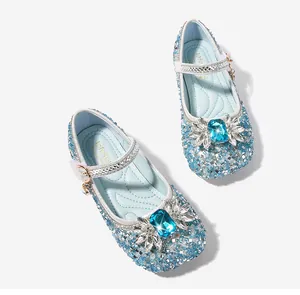 Detail of blue sequined Mary Jane princess shoes with crystal floral jewel and silver strap