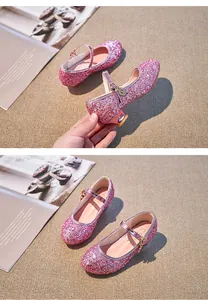 Close-up of pink sequin Mary Jane shoes for girls featuring adjustable buckle and low heel