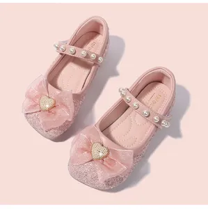 Pink sequin princess shoes for girls with large organza bow and pearl strap details