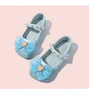 Detailed top view of blue sequin princess shoes with mesh bow and pearl strap