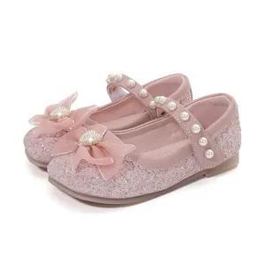 Pink glitter Mary Jane princess shoes for girls with pearl strap and bow detail