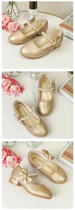Detail of champagne gold Mary Jane shoes featuring pearl buckle and delicate bow accents