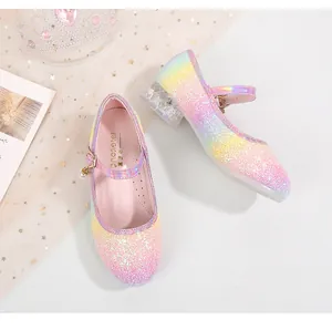 Detailed macro view of rainbow glitter girl shoes with transparent crystal heels and pearl