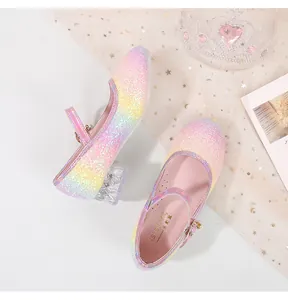 Detail of glitter rainbow Mary Jane shoe with crystal heel and pearl buckle on star mesh