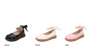 Drie Mary Jane-schoenen in zwart, wit en roze met parelbandjes en zijden strikjes