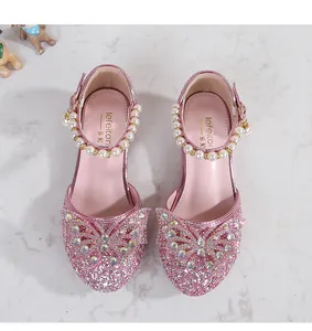 Detailed view of pink sequin girl's princess shoes with bow and pearl heel trim