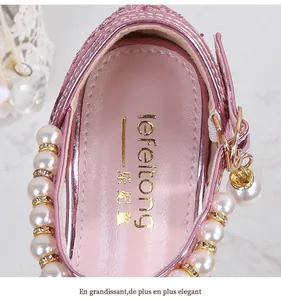 Close-up of pink glitter girls princess sandals with luxury pearls and rhinestone details