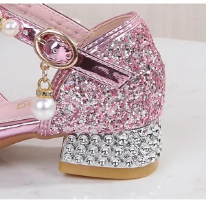 Detail of pink sequin girls sandals with rhinestone heels and pearl charms