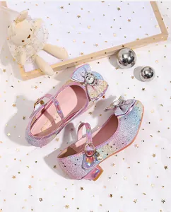 Detail of glitter gradient girls princess shoes with bowknot and rhinestone accents