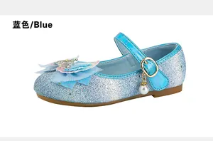 Detailed macro of girls blue sequin mary jane shoe with mesh bow and pearl charm