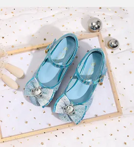 Macro view of blue sequin princess flat with crown crystal bow and silver buckles
