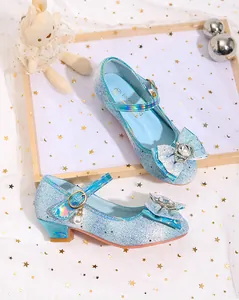 Detail of blue glitter girls princess shoes with crystal heart and pearl charm