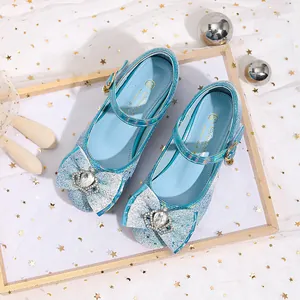 Sparkly blue Mary Jane princess shoes for girls with glitter bow and crown detail