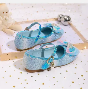 Detailed blue sequin Mary Jane shoes with glitter bow, crown decor, and pearl pendant