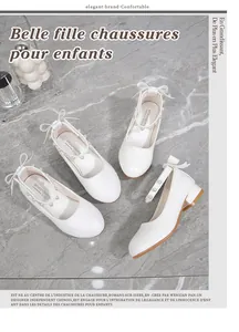 Detail of white girls dress shoes featuring pearl strap and 3D bow on the back heel