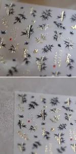 Macro detail of Chinese ink bamboo and golden butterfly nail stickers with 3D embossed texture