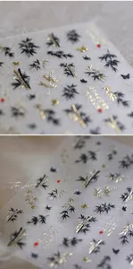 Detail of bamboo nail art stickers with gold foil, calligraphy and butterfly designs