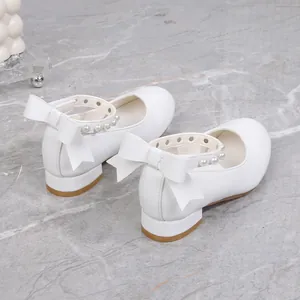White Mary Jane princess shoes for girls with elegant pearl strap and bow detail