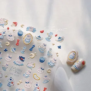 Detailed macro view of 5D embossed nail art stickers with Alice in Wonderland rabbit design