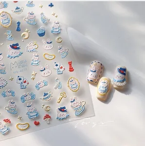 Detailed relief nail stickers featuring blue bunnies and fairy tale motifs for nail art