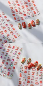 Detail of 3D embossed New Year nail stickers featuring cartoon snakes and fortune bags