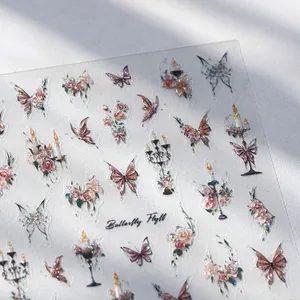 Bronzing butterfly and flower nail art stickers with holographic texture on white backdrop