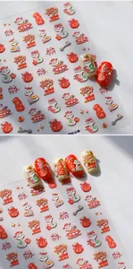 Detail showing 3D embossed snake zodiac and festive red gold nail art stickers
