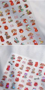 Macro detail of Year of the Snake nail decals with 3D embossed red and gold festive patterns