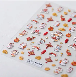 Detailed macro shot of 3D embossed Chinese Zodiac Snake nail art decals with koi and luck knots